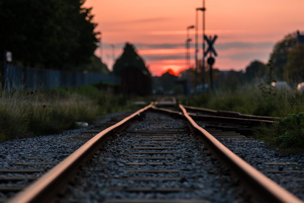 shallow focus photography of railway during sunset 892541